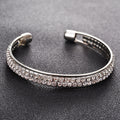 Bracelet ouvert 2 rangs sertis, or rose et argent