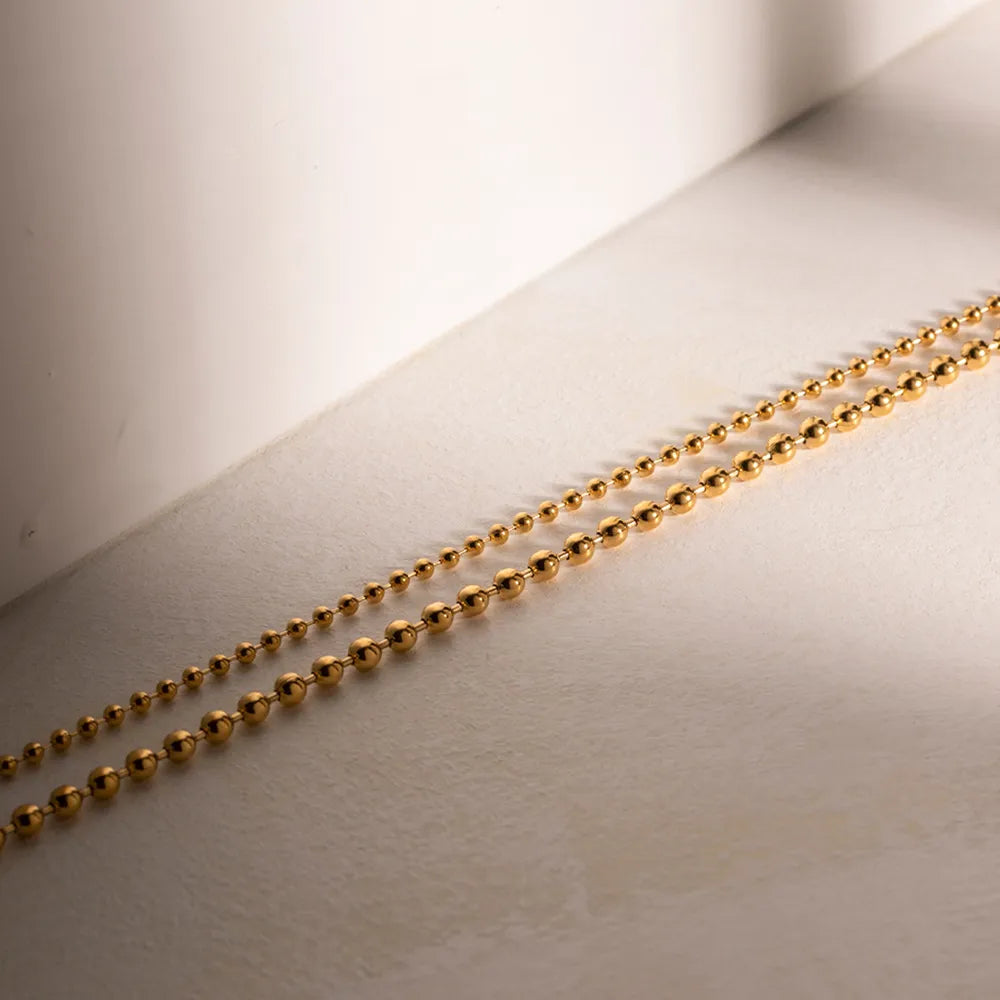 Collier de perles, plaqué or 18 carats