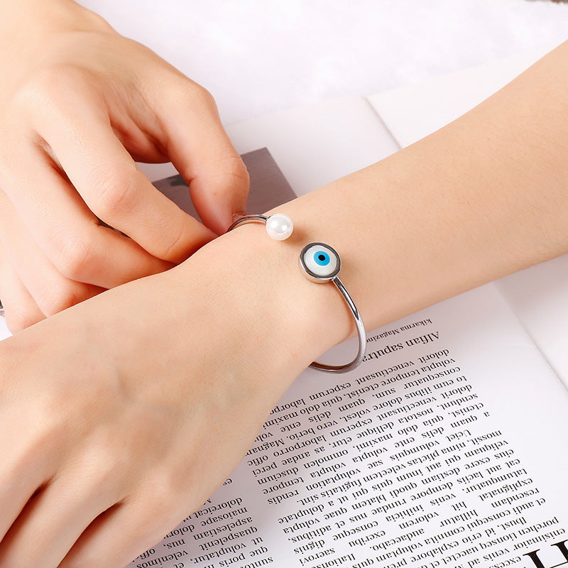 Bracelet ouvert perle et œil protecteur porte-bonheur
