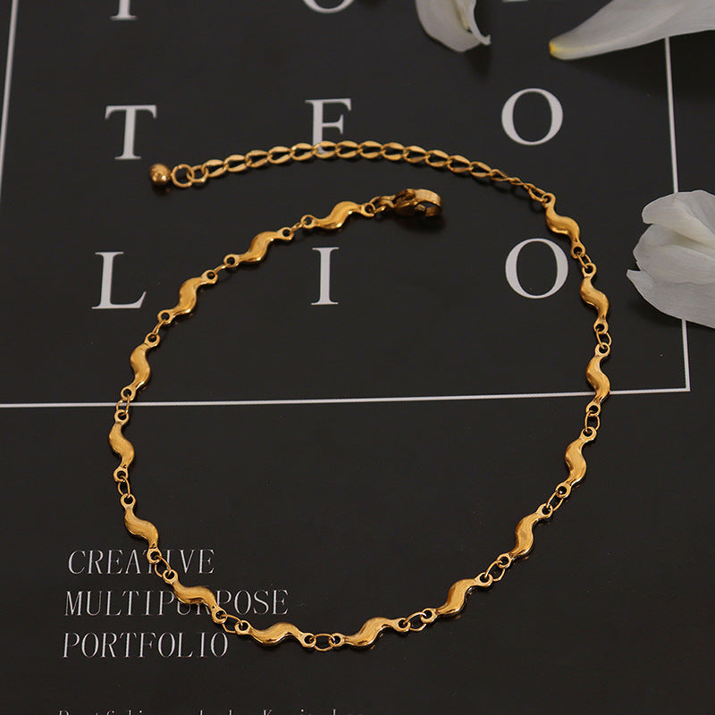 Bracelet de cheville dauphin, acier titane plaqué or