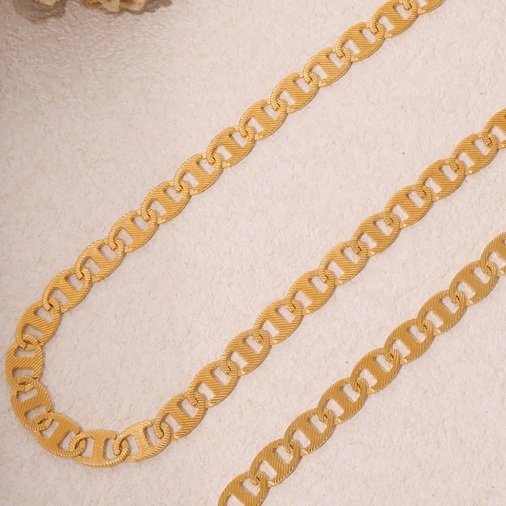 Collier plaqué or, acier titane