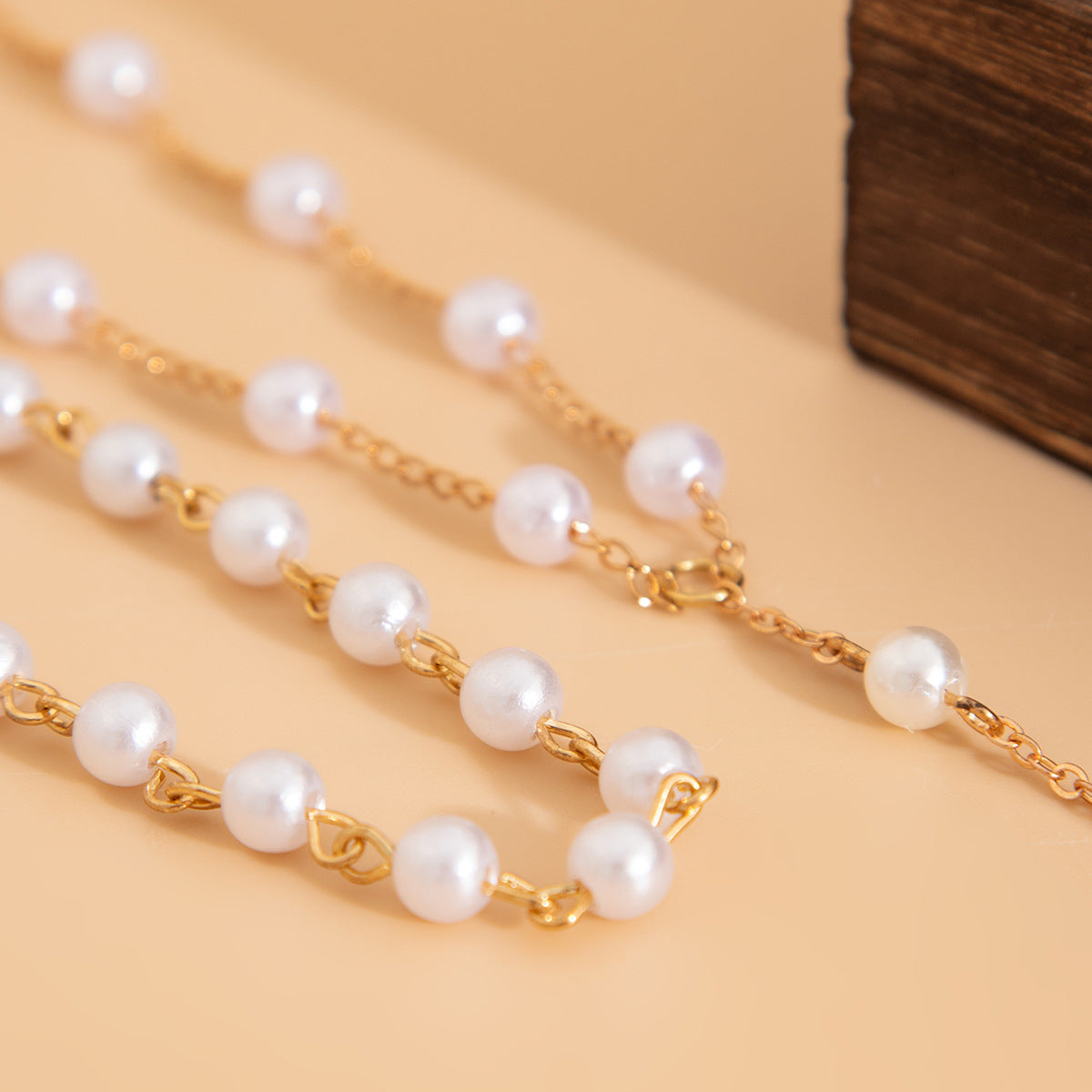 Collier multi-rangs perles et pompons, style français