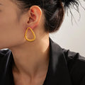 Boucles d'oreilles torsadées, plaqué or 18 carats