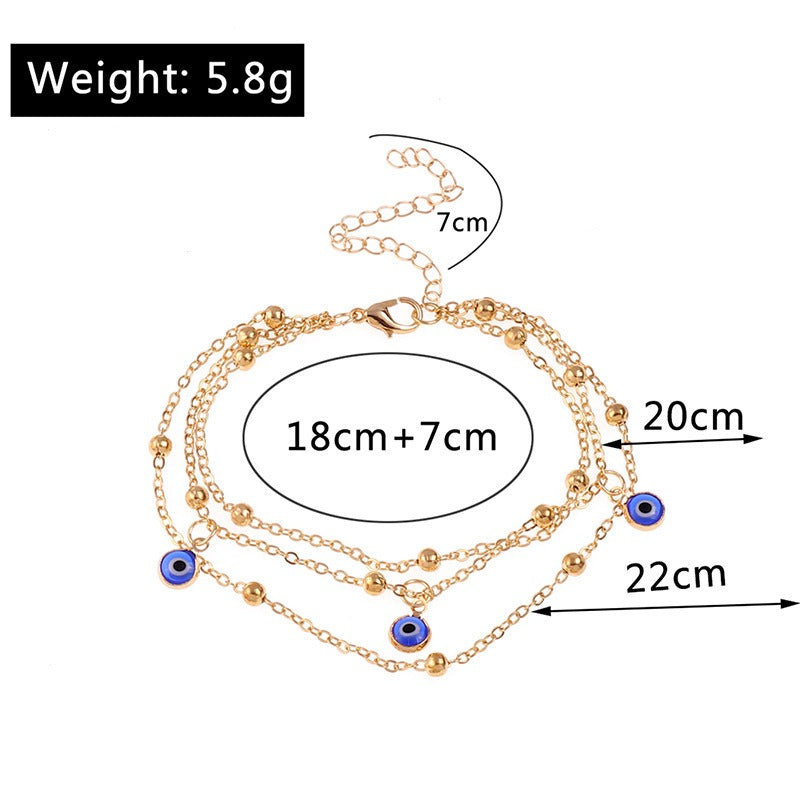 Bracelet de cheville pendentif perle et œil protecteur