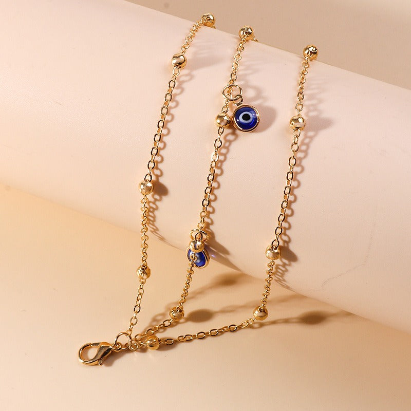 Bracelet de cheville pendentif perle et œil protecteur