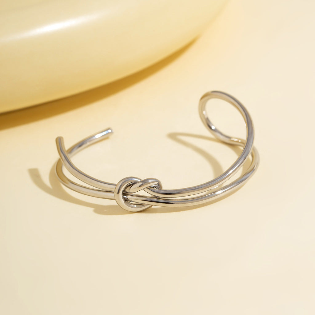 Bracelet ouvert double nœud ajouré, style commuter