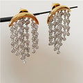 Boucles d'oreilles à pompons, design unique