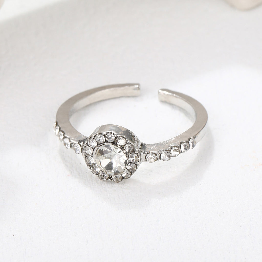 Bague ouverte perle et zircon, design épuré