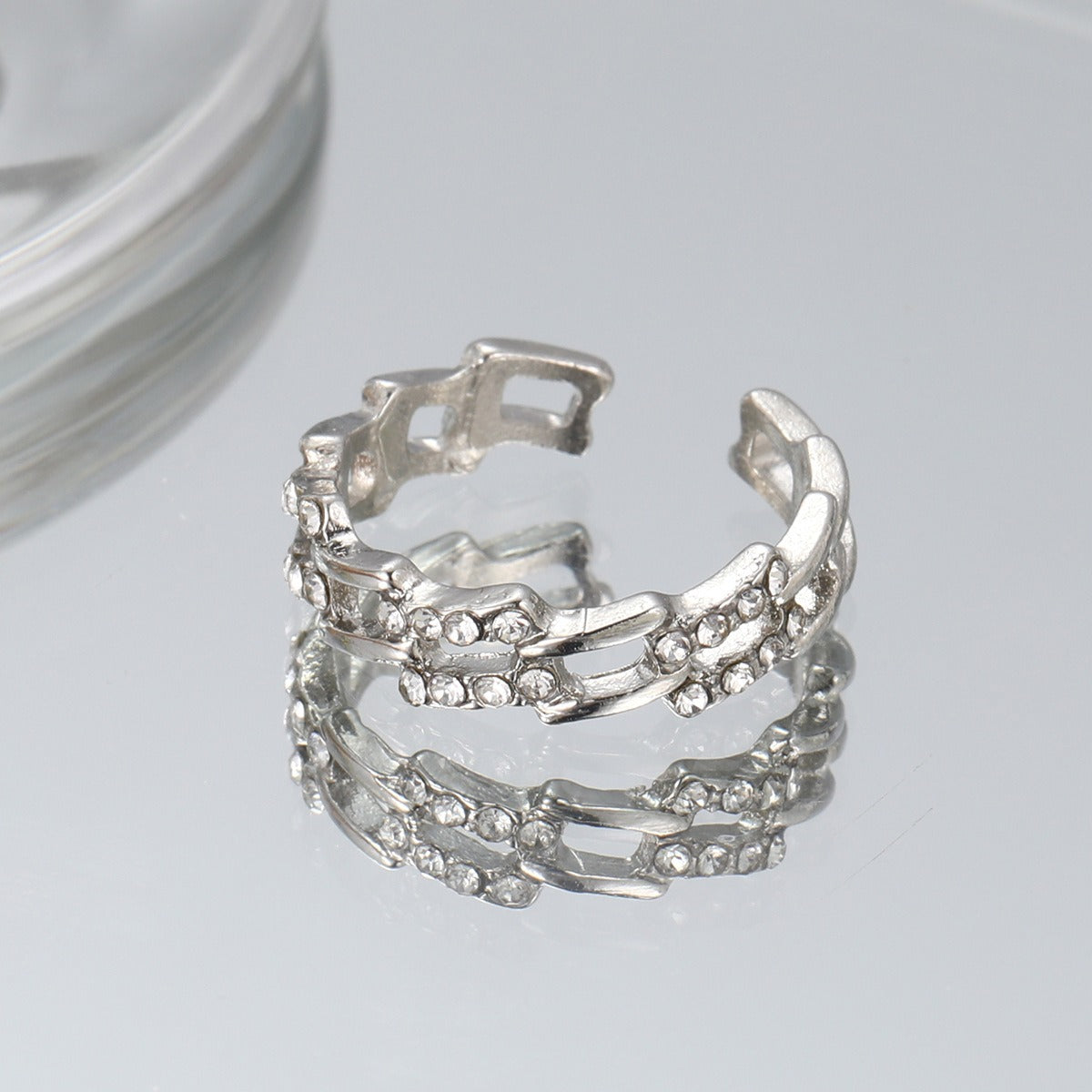 Bague ouverte perle et zircon, design épuré