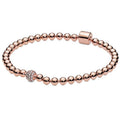 Bracelet coulissant perles et cristal pavé, or rose