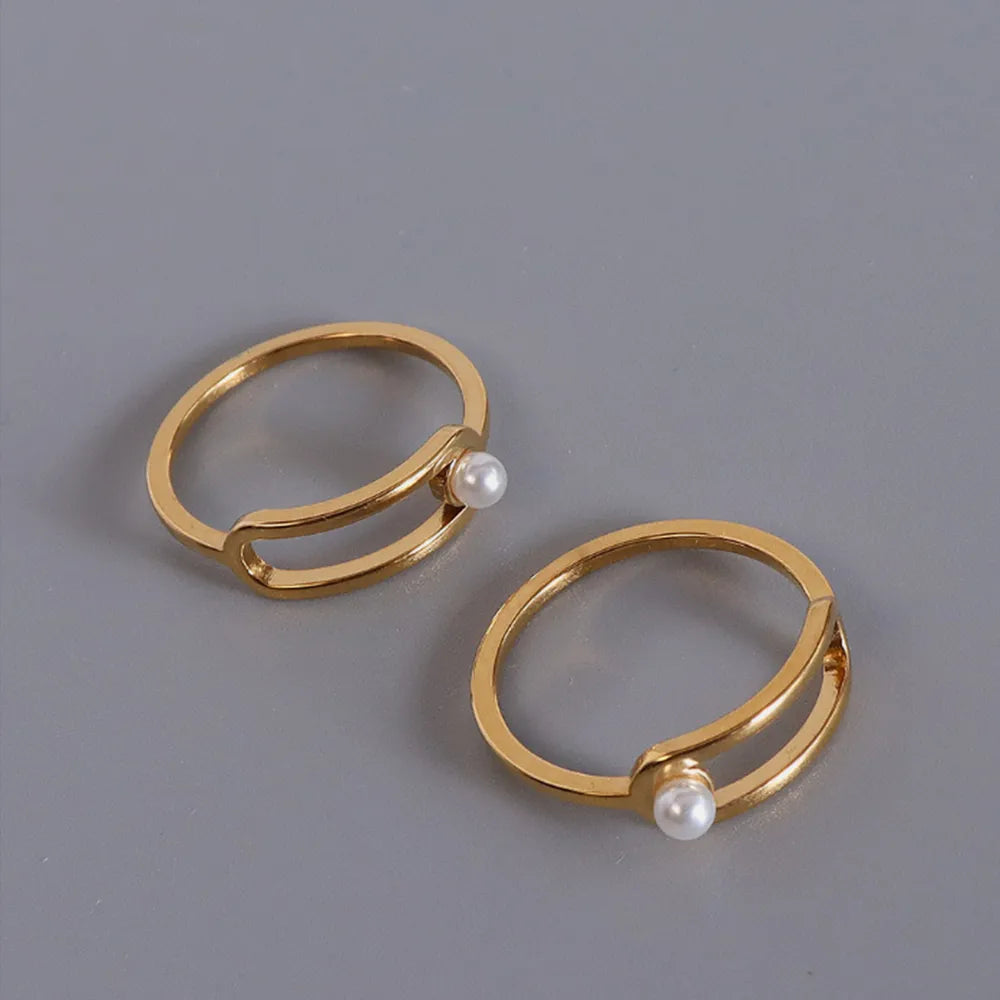 Bague ronde perle, acier titane plaqué or